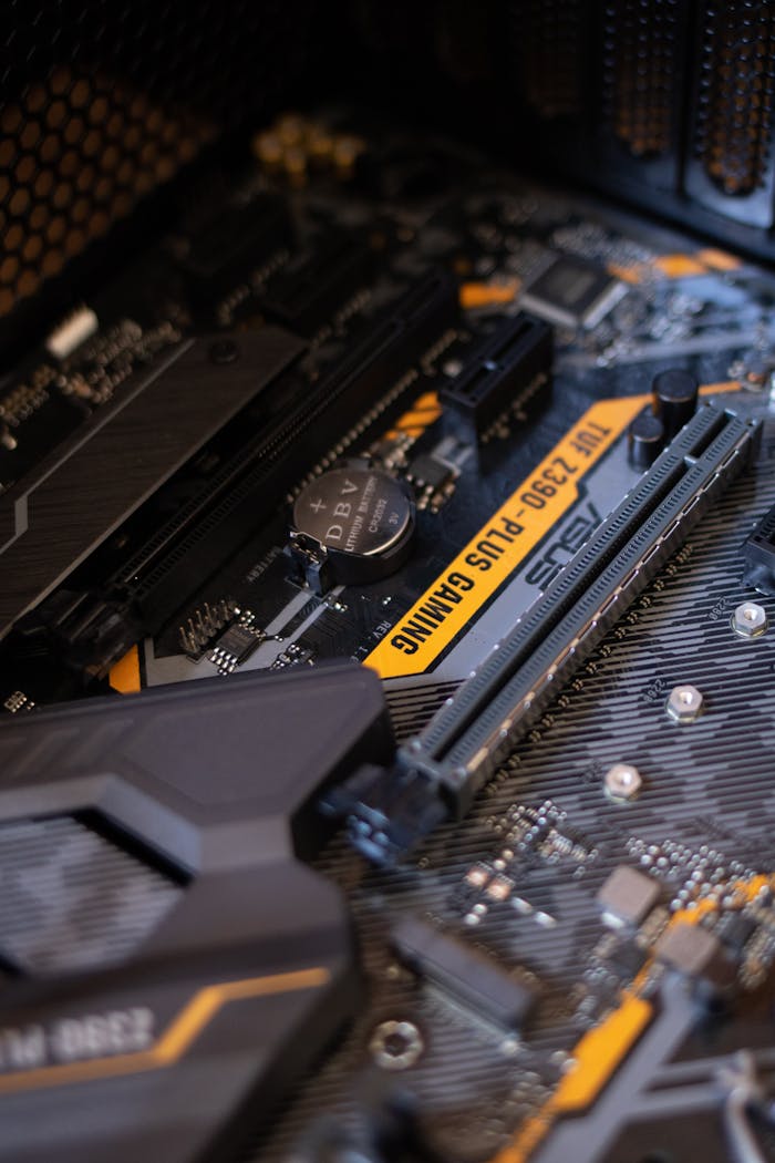 services-04 Detailed view of a gaming motherboard with capacitors and microchips.