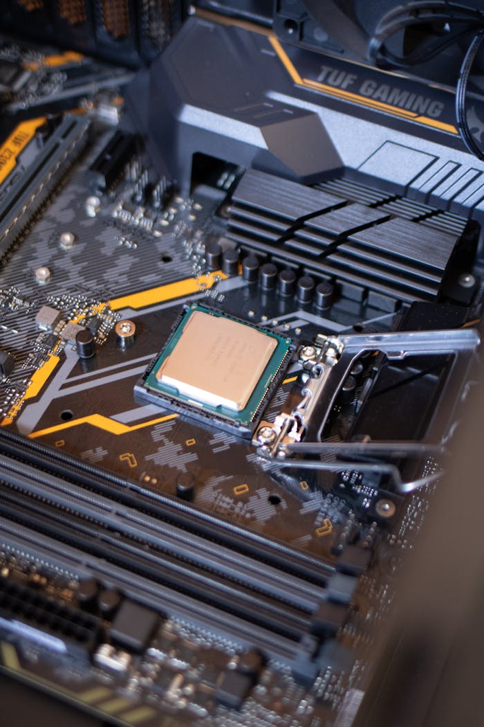 services-03 Detailed view of a motherboard with an exposed CPU, showcasing technology components.