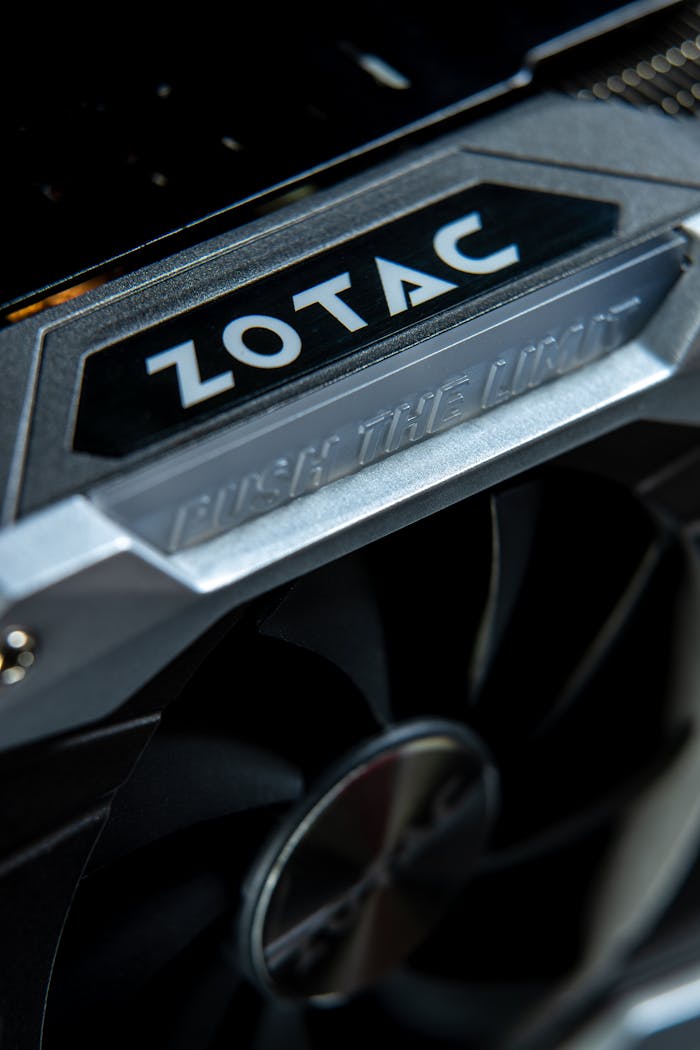 team-01 High angle close-up shot of a Zotac graphics card fan with metal accents.
